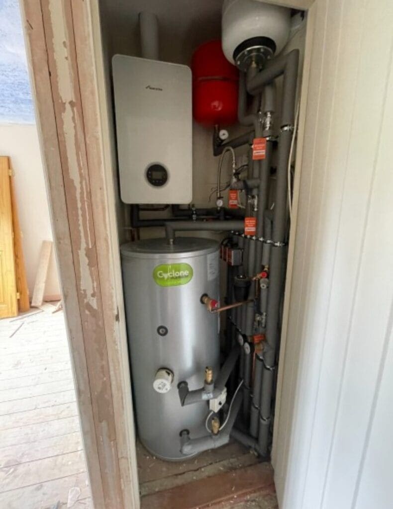 Gas boiler and hot water cylinder installation in Norwich with expansion vessel and pipework