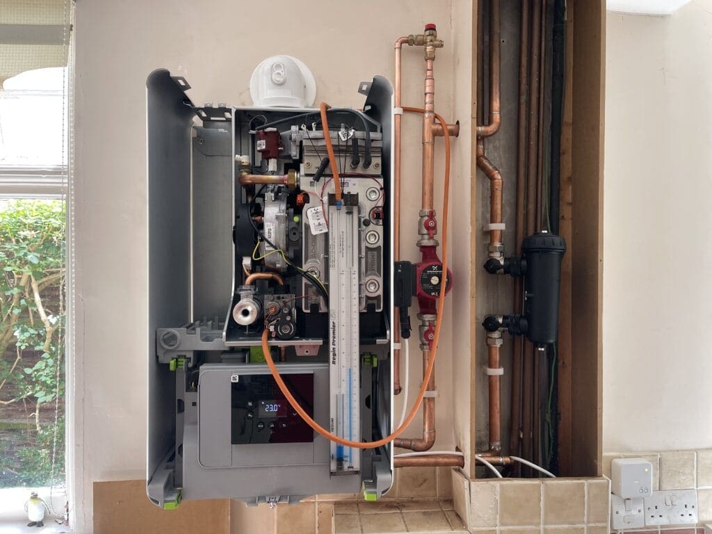 Boiler Servicing in Coltishall: Keep Your Village Home Warm and Efficient | Allstar Systems Ltd Engineer carrying out boiler servicing in a Coltishall village home