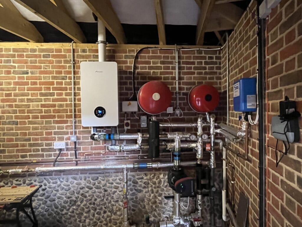 Commercial plumbing and heating engineer working at a Hunstanton visitor premises