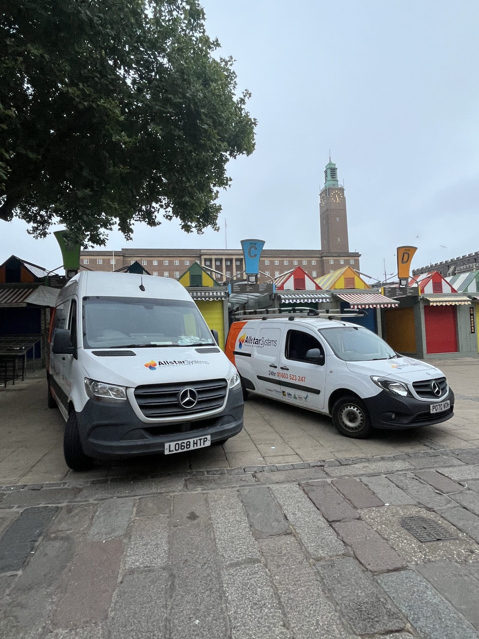 Allstar Systems plumbing and heating vans in Norwich city centre near the market