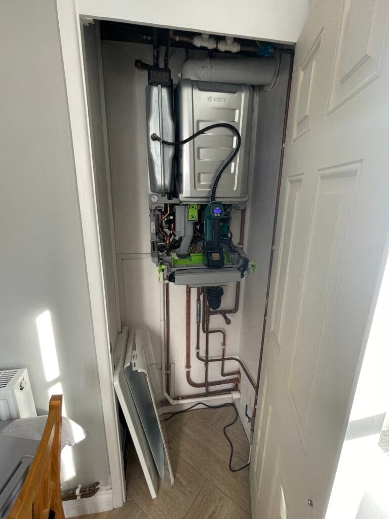 Heating engineer checking recurring boiler pressure loss in a North Walsham home