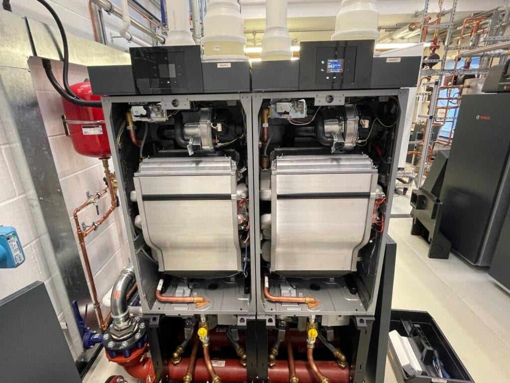Commercial boiler plant room with gas boilers, pipework, testing and purging equipment