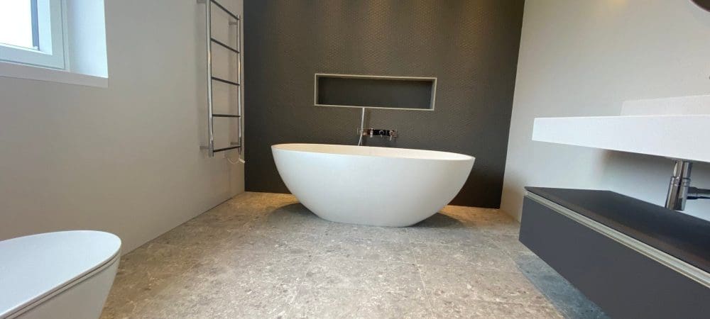 Bathroom renovation planning with plumbing and heating checks in a Dereham home