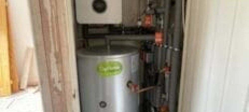 Heating engineer assessing boiler setup options for a Wroxham home near the Broads