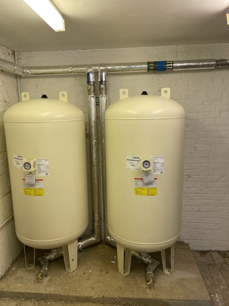 Twin Mainsboost water accumulator tanks installed to improve water pressure and flow rate in Norfolk